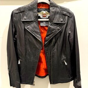 Harley jacket. Zipped sleeves, zipped sides, numerous pockets, super thick.